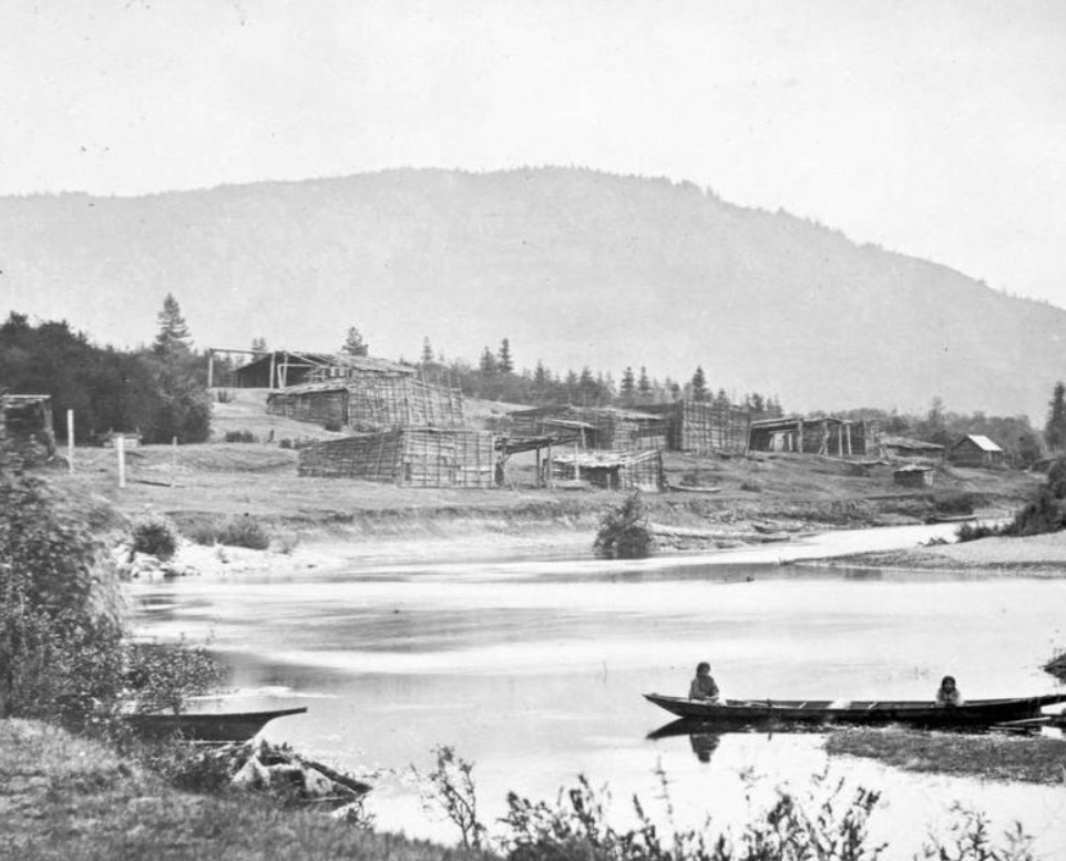 The Quamichan [Hul’qumi’num] Village. Vancouver Island, East Coast. Possibly the village of Kw’amutsun on the Cowichan River.